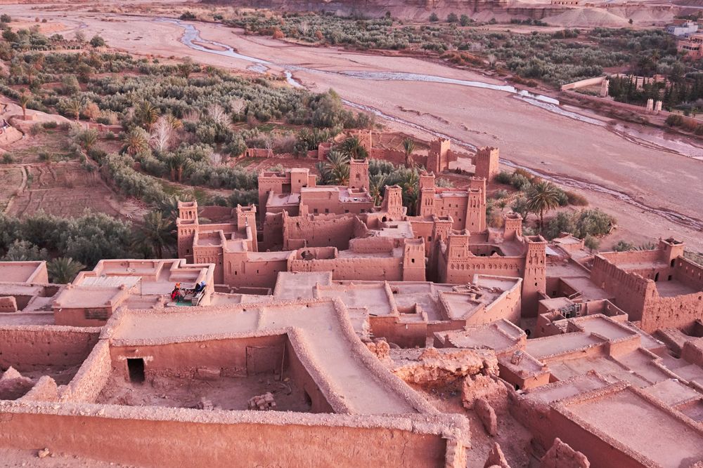 Ancient city near river in desert and wonderful sky