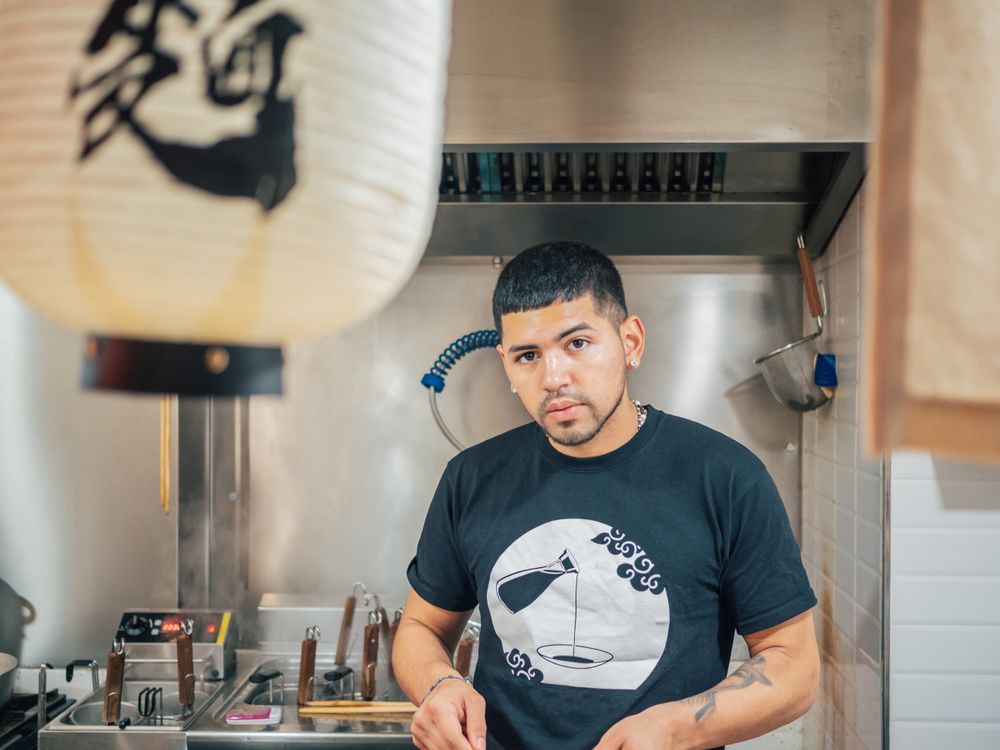 Handsome male cooking in kitchen