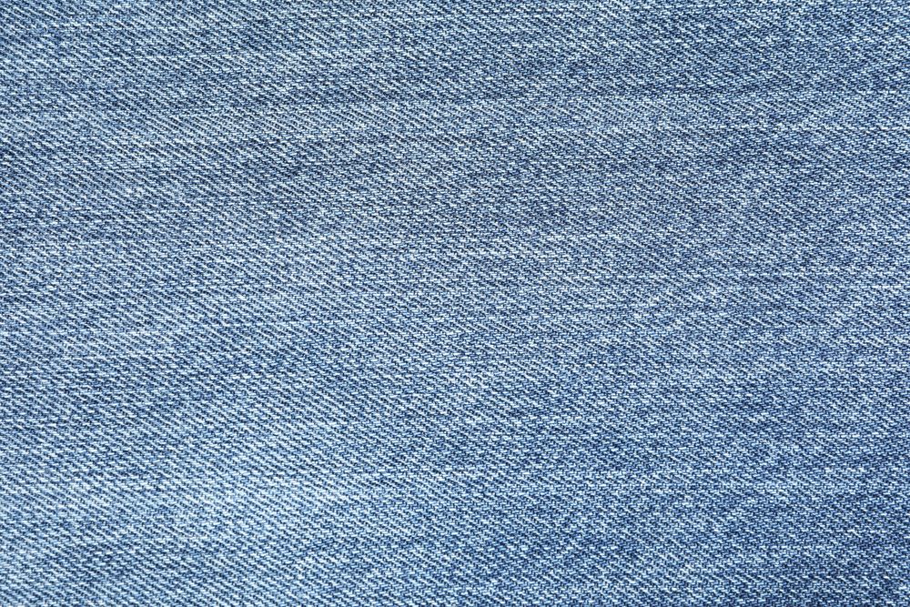 Texture of blue jeans as background, space for text