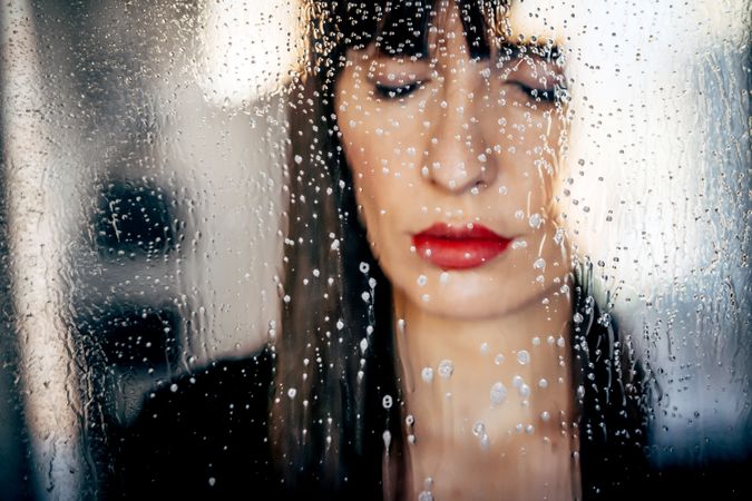 Stylish woman kissing glass