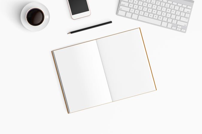 Modern workspace with coffee cup, smartphone, paper, notebook, tablet and laptop copy space