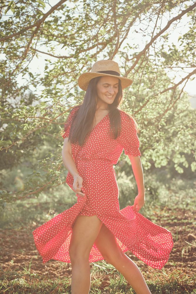 Woman in summer dress and hat