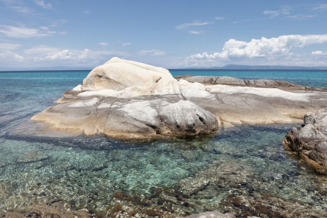 Rocky hill in crystal water