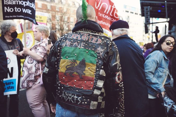 London, England, United Kingdom - March 19 2022: Back of punk man in studded leather jacket
