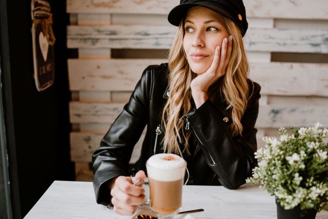 Woman drinking coffee from a glass