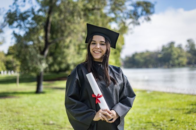 Happy graduate with long brown hair