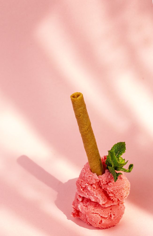 Strawberry ice cream scoops with waffle stick