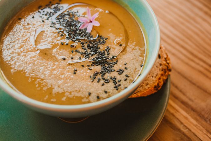 Tasty soup puree with seeds in bowl