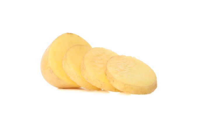 Potato sliced on blank background