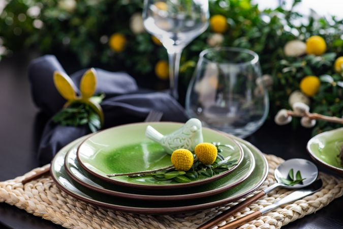 Decorative ceramic bird on plate for Easter table setting