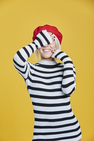 Happy young female in red beret