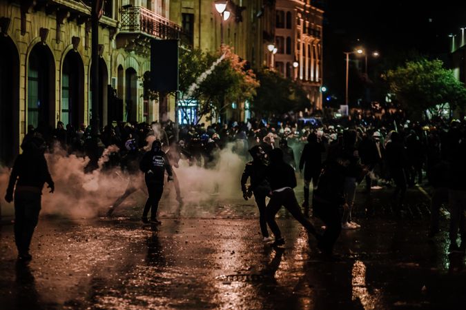 Protestors under police brutality in downtown Beirut