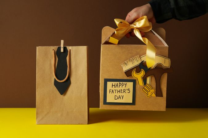 Father's day concept, gifts and greetings, on a brown background.