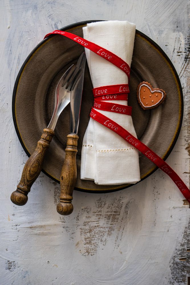 St. Valentine day card concept with brown plate and heart