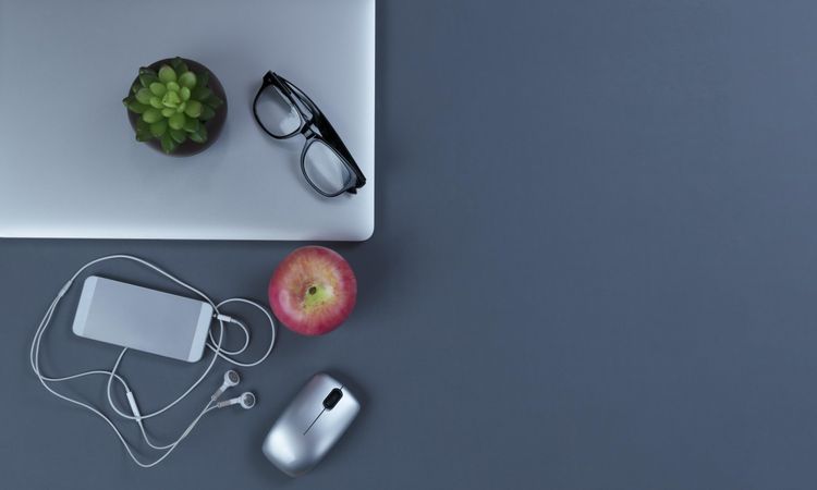Teleworking gray desktop with modern mobile devices