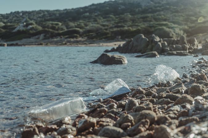 Plastic bottle lying on seashore
