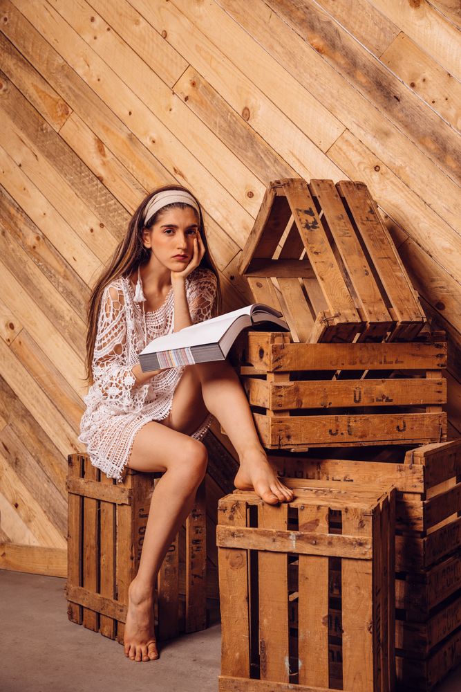 Young woman posing with a book