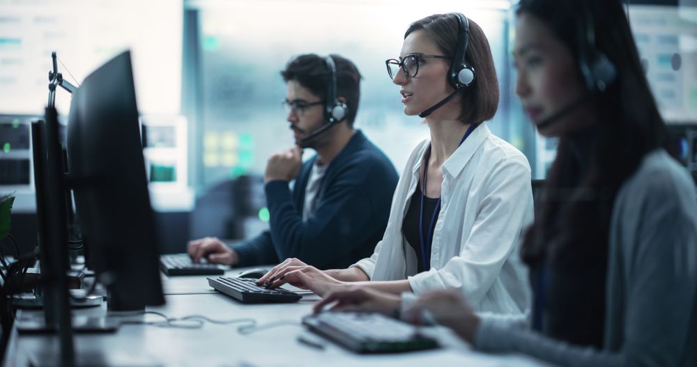 Help Desk Specialist Having a Conversation on a Call, Providing Technical Support to Client Experiencing Computer Hardware