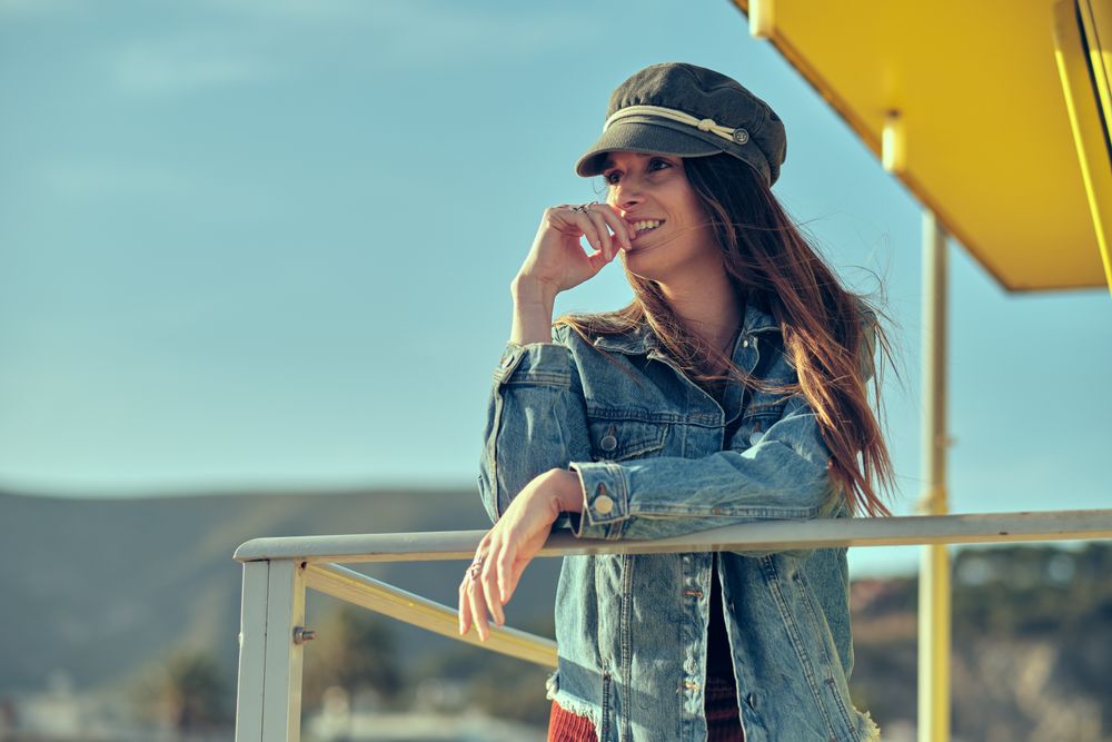 female standing on balcony on nature