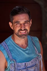 Cheerful worker in denim overall