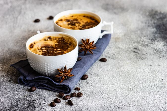Two cups of morning coffee with star anise
