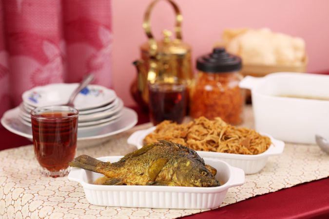 Ikan Goreng Nila Tilapia on Red Table
