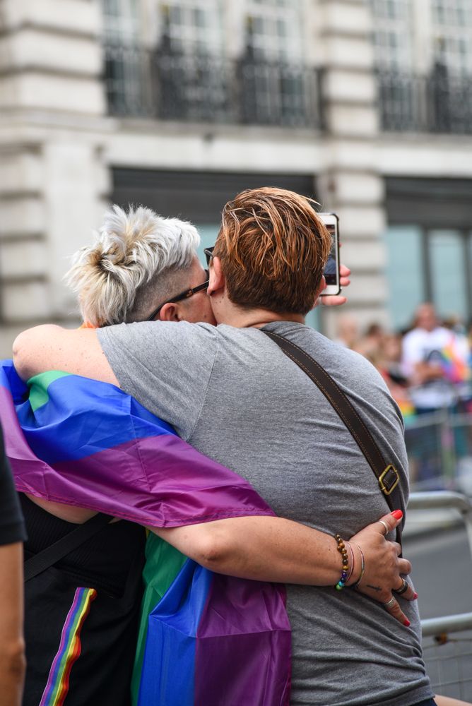 Two men hugging each other