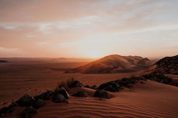 Sunset sky over hills in desert
