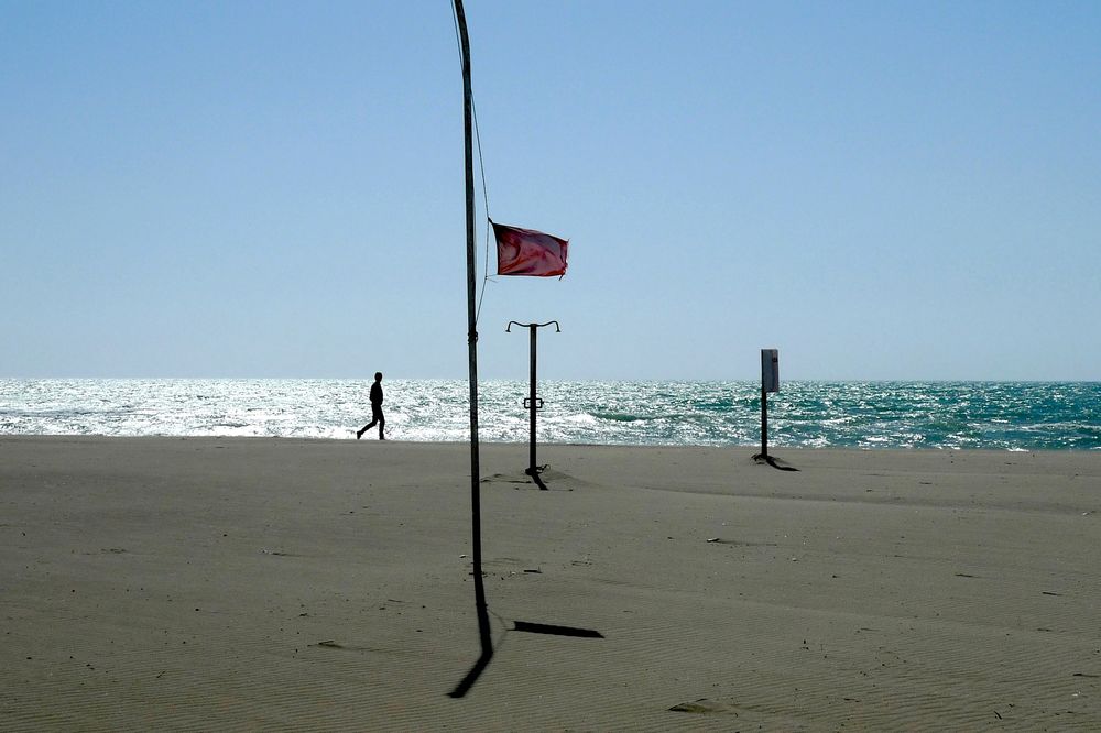 Man walking along the beach