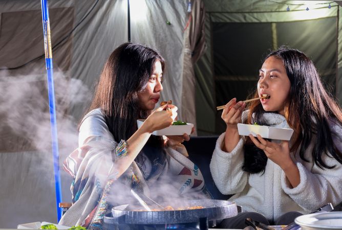 Two Young People Eating Beef