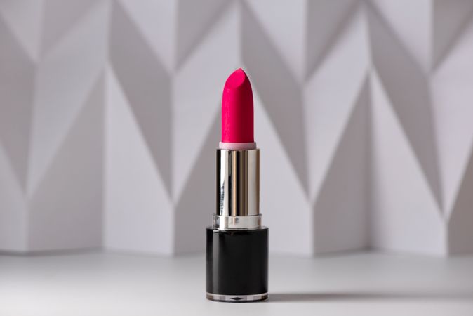 Red lipstick on raised chevron, Product and make up contemporary concept