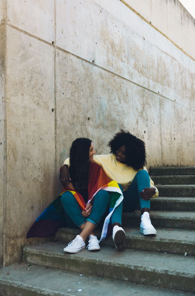Two women with LGBT flag