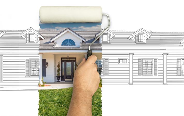 Before and After of Man Painting Roller to Reveal Custom Home Photograph Under Pencil Sketch Drawing Plans.