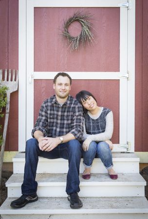 Interracial Couple Relaxing on the Steps