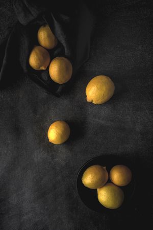 Fresh lemons on dark background.
