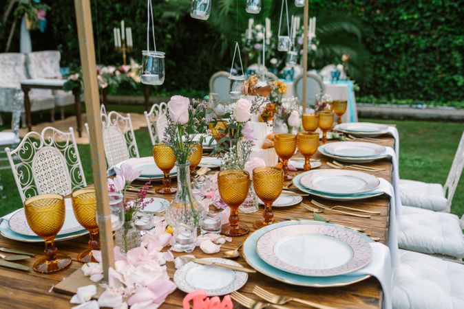 Wedding table decoration in rustic style placed outdoors