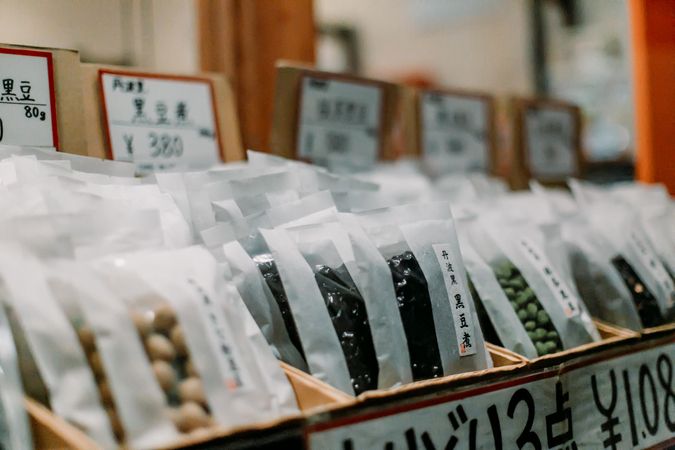 Packed beans with kanji text in a store