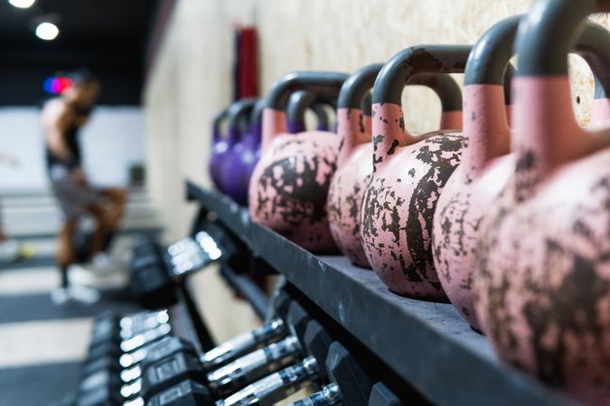 Dumbbells and kettlebells in gym