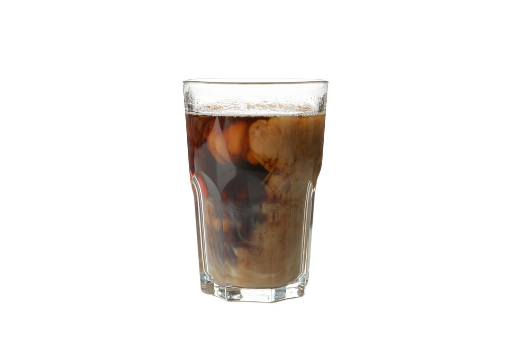 Glass of ice coffee isolated on plain background