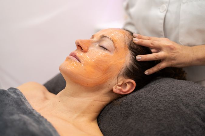 Woman receiving treatment in spa