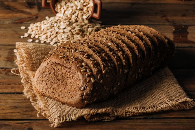 Freshly baked rye bread on napkin on table