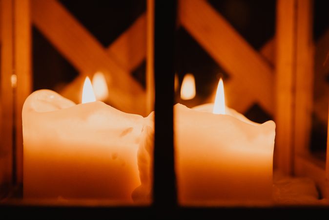 Burning candles in darkness