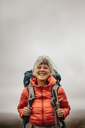 Happy woman on vacation enjoying hiking trip outdoors