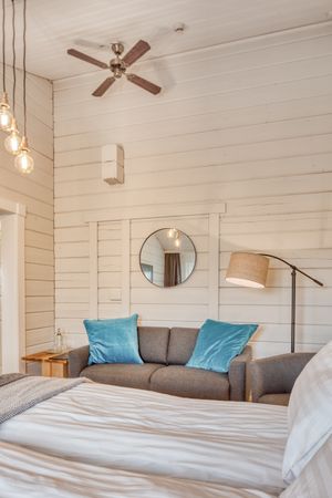 Cozy interior of bedroom with sofa