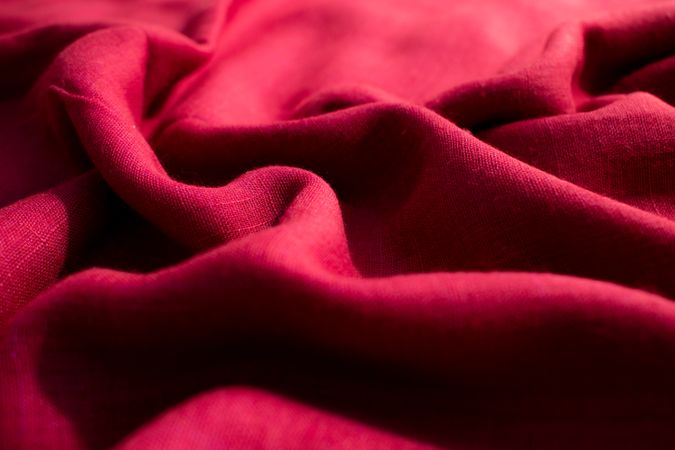 CLose up Red fabric wavy crumpled background texture.