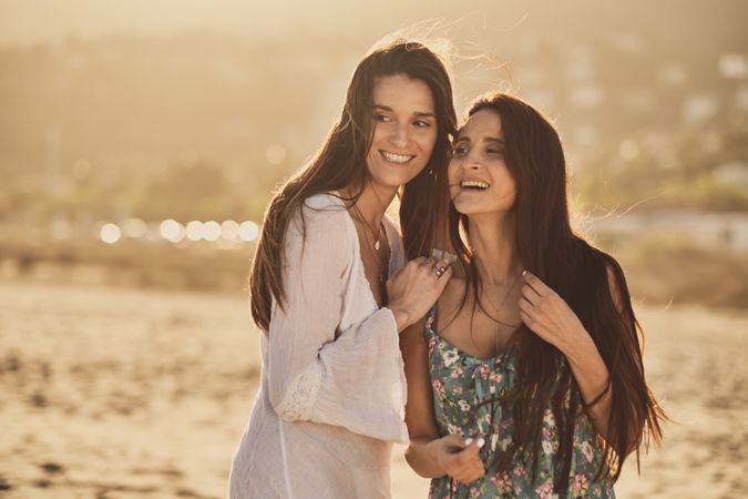 Two happy girls in a summer day at the beach