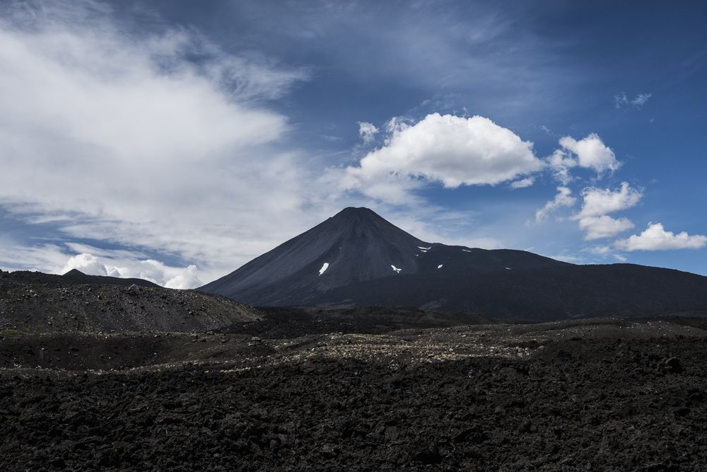 Mountain peak abutting sky in desert valley