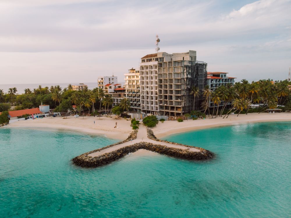 Exterior view of beach resort across the seashore in Maafushi, North Central Province, Maldives