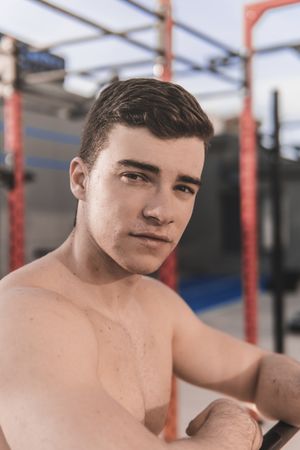 Shirtless man on sports ground