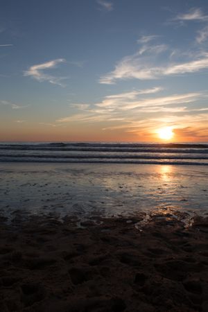 Picturesque view of sandy beach at sunset